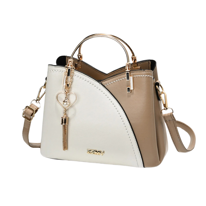 Chic women's patchwork tote bag with stylish tassel charm, an elegant shoulder or everyday fashion accessory.