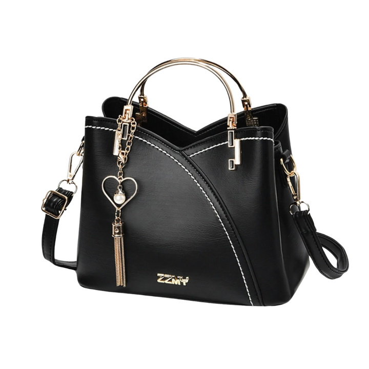 Unique ladies patchwork tote bag with vintage style, tassel charm, and large capacity for a stylish everyday accessory.