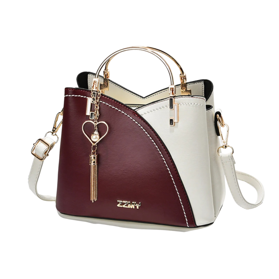 Fashionable and chic patchwork tote bag with tassel charm, an organized everyday handbag for women.