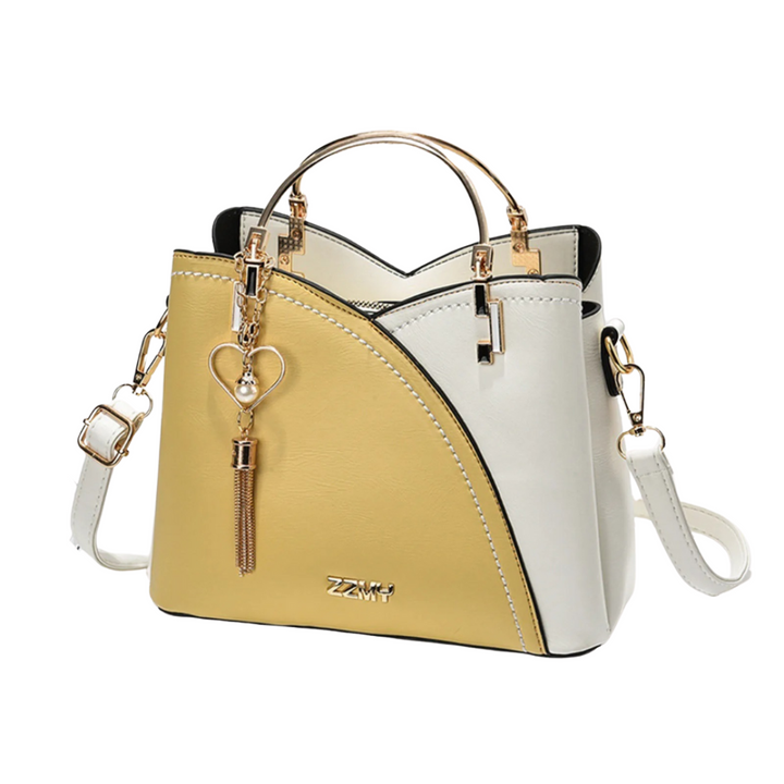 Stylish women's unique patchwork tote bag with tassel charm. A large capacity everyday shoulder bag.
