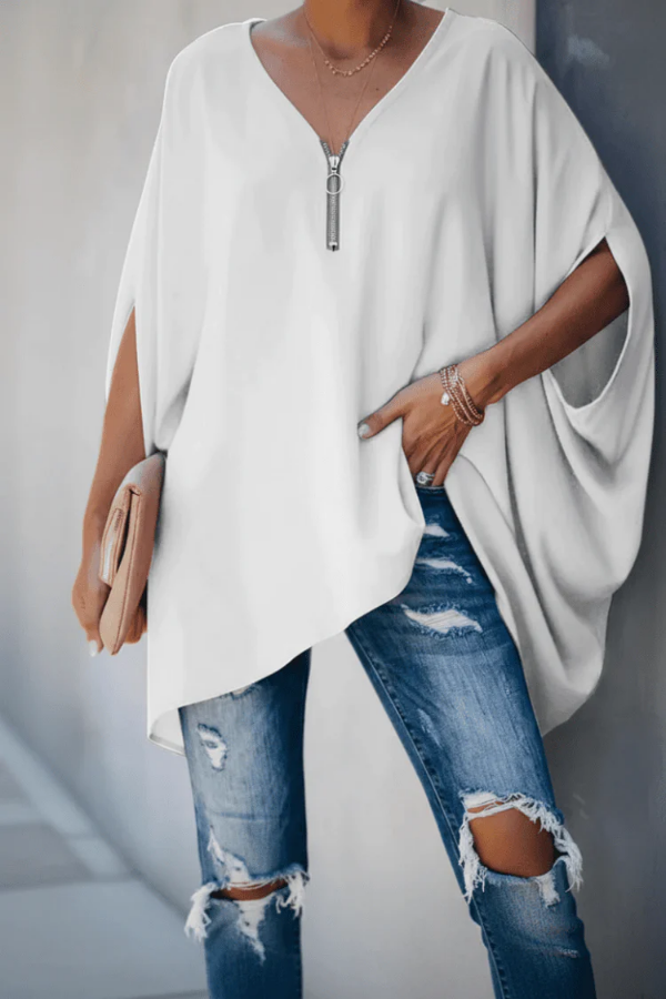 Stylish white pleated V-neck women's blouse, a chic versatile top for spring fashion.