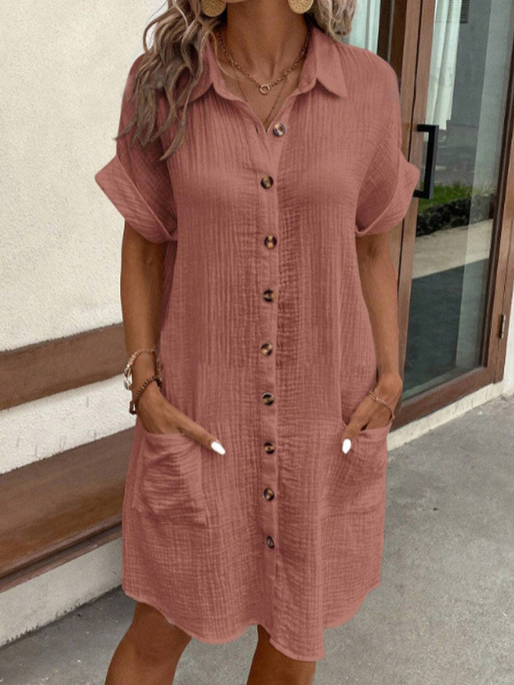 Modern women's chic polo mini dress, short sleeve, with functional pockets for everyday elegance.
