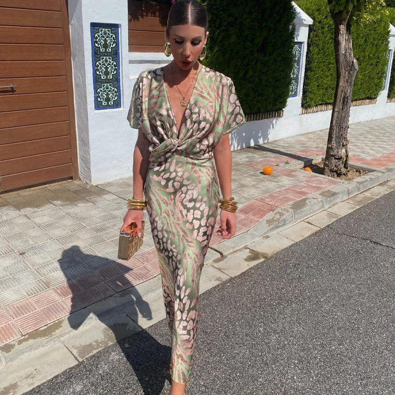Chic women's printed maxi dress with twist front & V-neck, perfect for wedding guests or elegant special occasions.