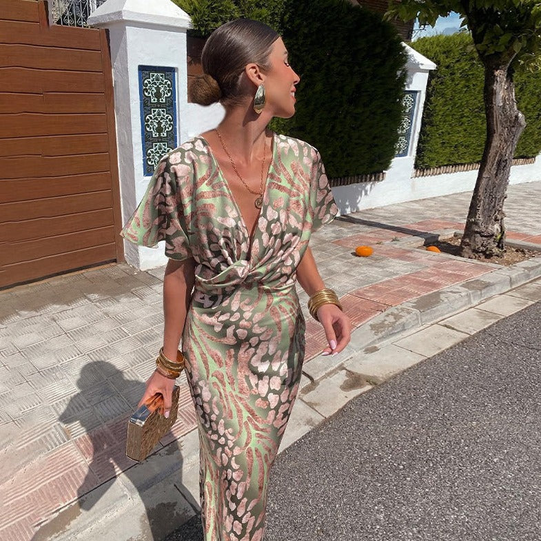 Elegant women's printed maxi wedding guest dress with draped sleeves and a flattering V-neck, ideal for special events.