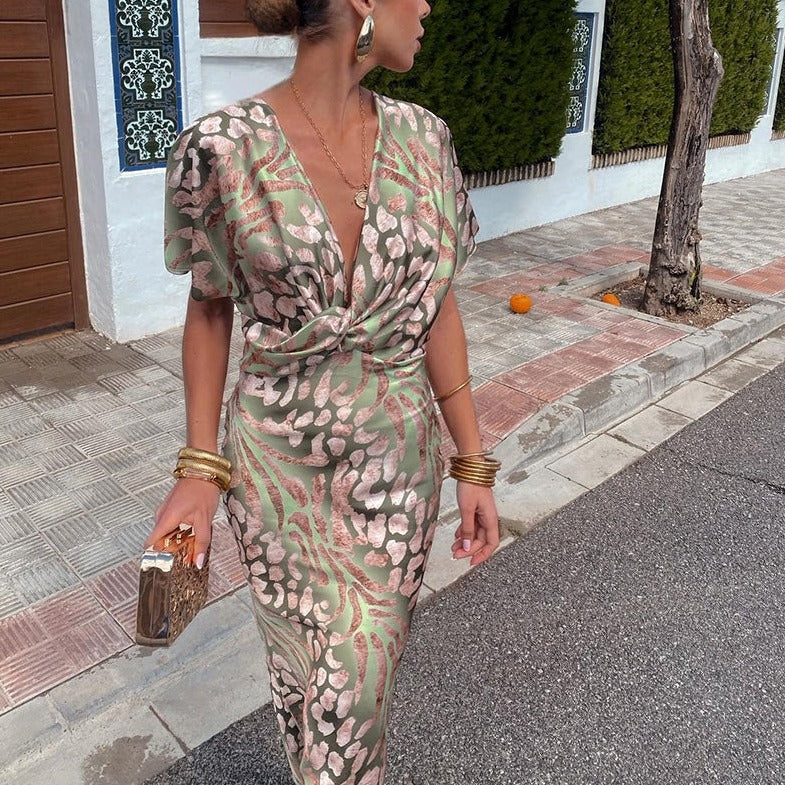 Sophisticated women's printed maxi dress, chic V-neck twist design. Perfect cocktail or evening wear for special guests.