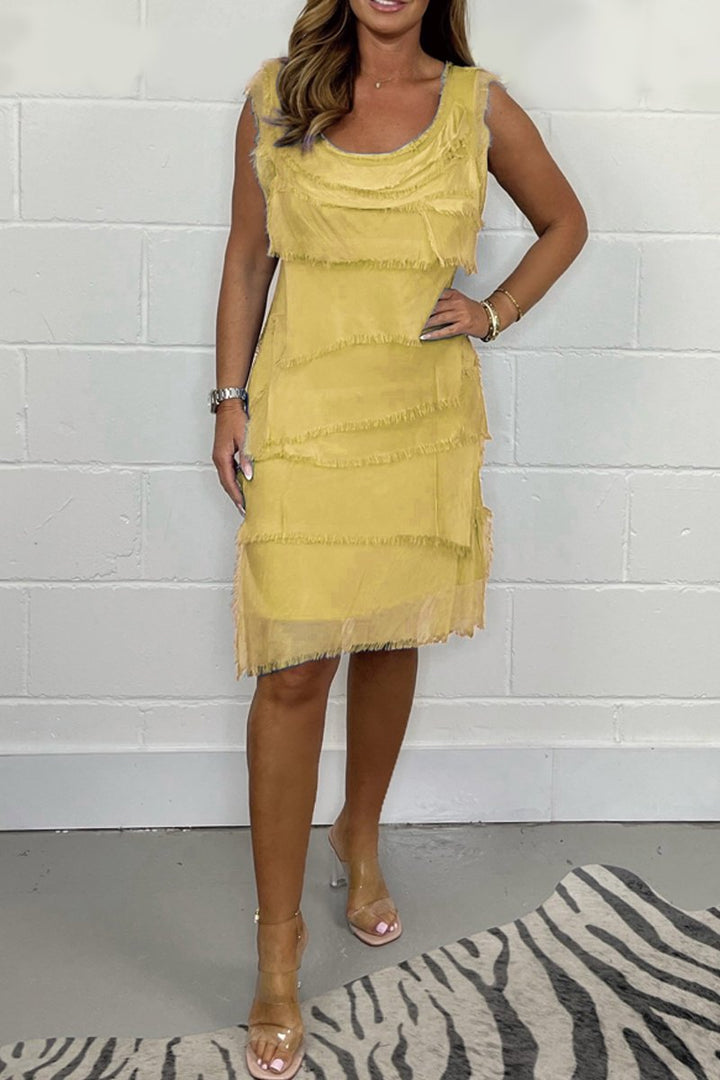Model in an elegant sleeveless layered women's dress, perfect for a sophisticated party or event.