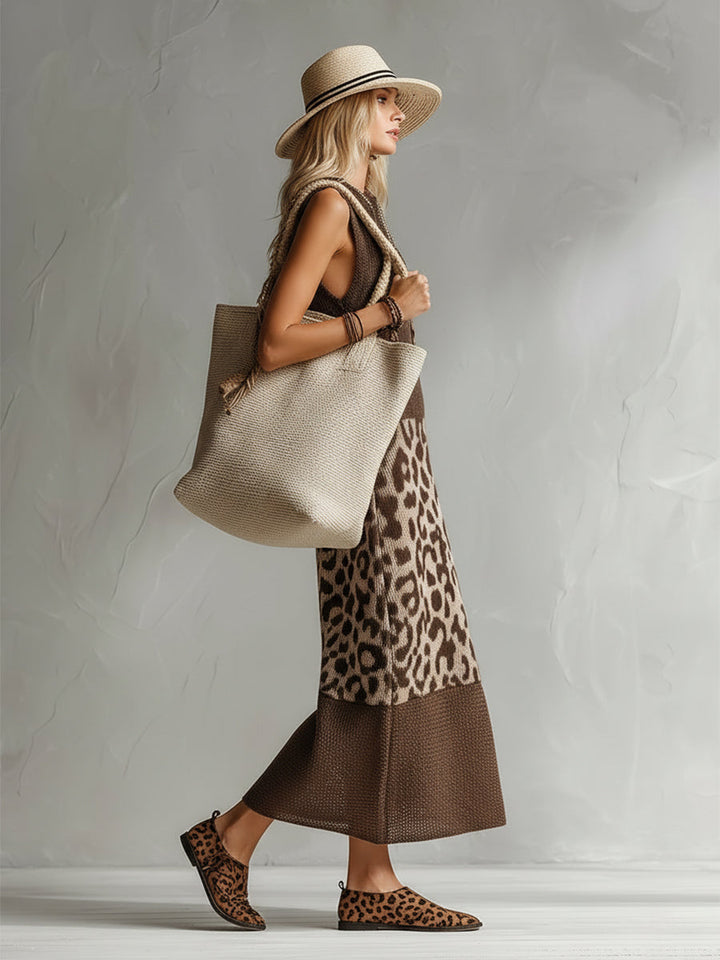 Elegant leopard print midi dress for women. Versatile sleeveless design, perfect for casual or day-to-night fashion.