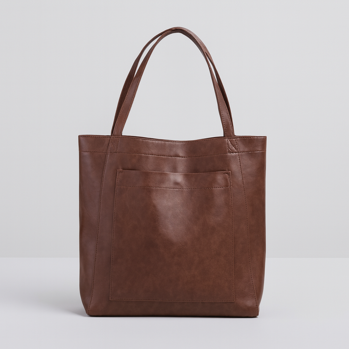 Versatile women's structured tote bag. Ideal as a daily carryall or work bag, featuring a convenient exterior pocket.