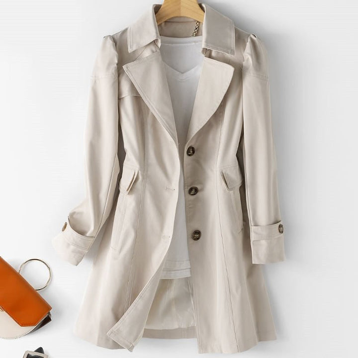 Chic women's tailored trench coat, perfect versatile outerwear for office to evening, classic style.