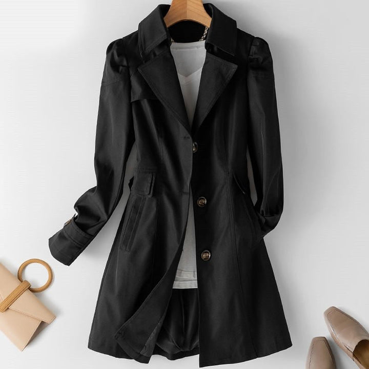 Elegant beige women's trench coat, a classic long spring & fall jacket, ideal for business casual style.