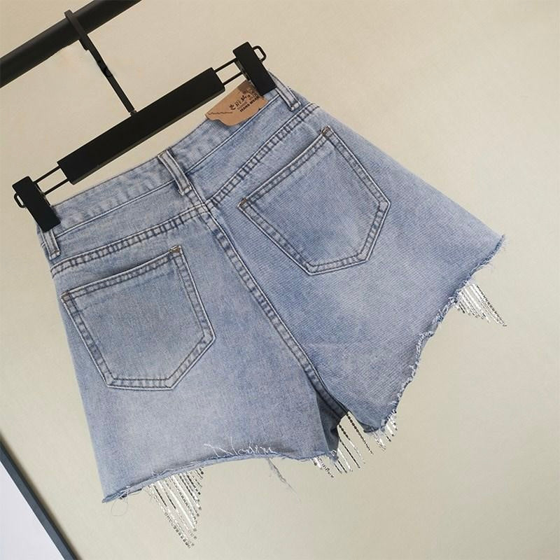 Women's versatile shorts featuring chic tassels. Perfect casual summer fashion bottom, stylish for vacation.
