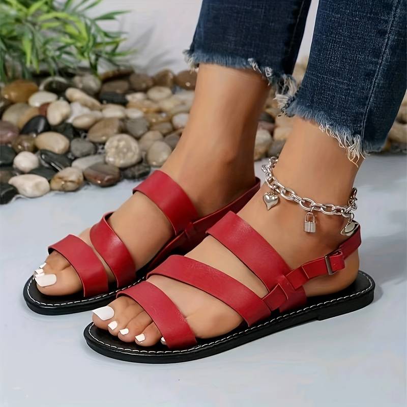 Comfortable open-toe flat summer sandals for women with three elegant straps, ideal for beach or daily wear.