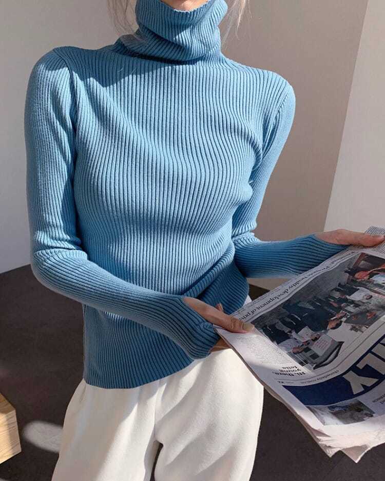 Classic women's long sleeve turtleneck sweater, a timeless knit pullover for chic winter style.