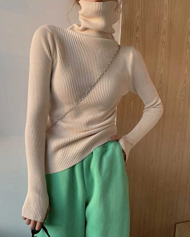 Fashionable women's turtleneck knit sweater, a versatile long sleeve top for elegant fall outfits.