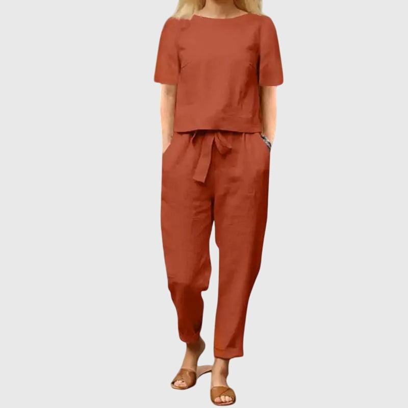 Modern women's fashion set: a chic crop top paired with flowing belted trousers. Ideal for a stylish summer outfit.