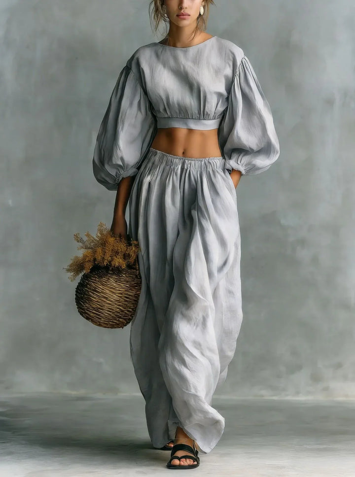 Elegant women's balloon sleeve two-piece set, featuring a cropped top & wide-leg trousers. Ideal for vacation/casual.