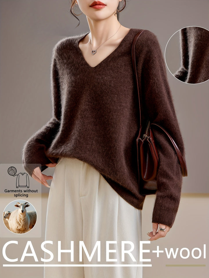 Chic women's V-neck sweater, cozy knitwear for elegant autumn style. Relaxed fit & versatile layering piece.