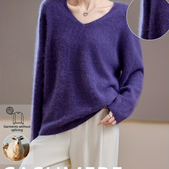 Comfortable women's V-neck sweater, a chic oversized knitwear piece for elegant autumn layering and cold weather.