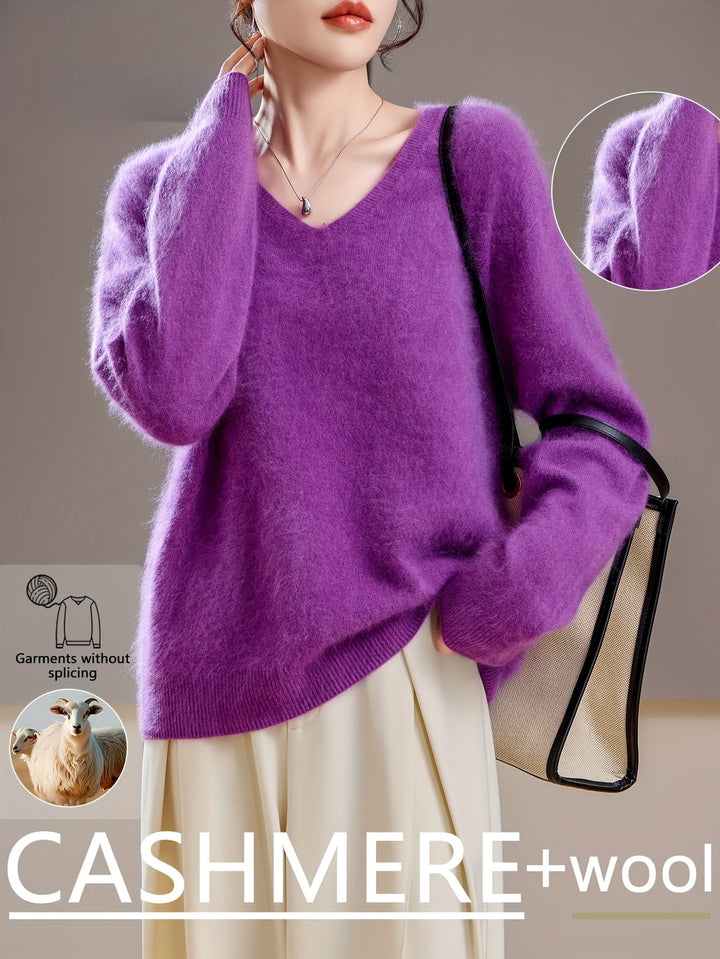 Comfortable women's oversized V-neck sweater. Soft, cozy knitwear perfect for cold weather autumn fashion.