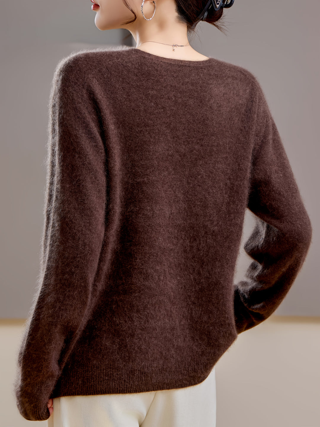 Versatile women's V-neck sweater, perfect layering piece for autumn fashion. Comfortable & chic oversized knitwear.