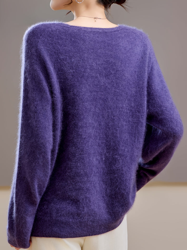 Elegant women's V-neck sweater with a relaxed fit. Chic oversized knitwear, perfect for effortless autumn fashion.