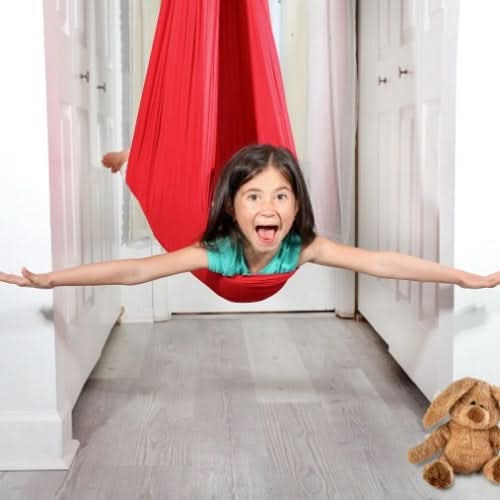 Children's calming sensory swing for indoor use, enhancing focus & regulation, great for special needs.