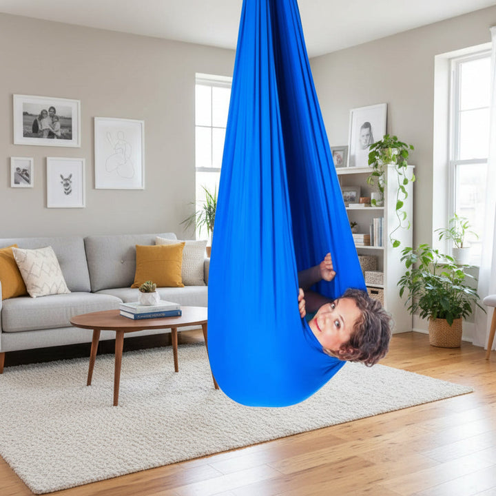 Soft, comfortable indoor sensory swing helps children with focus, calm, & sensory regulation.