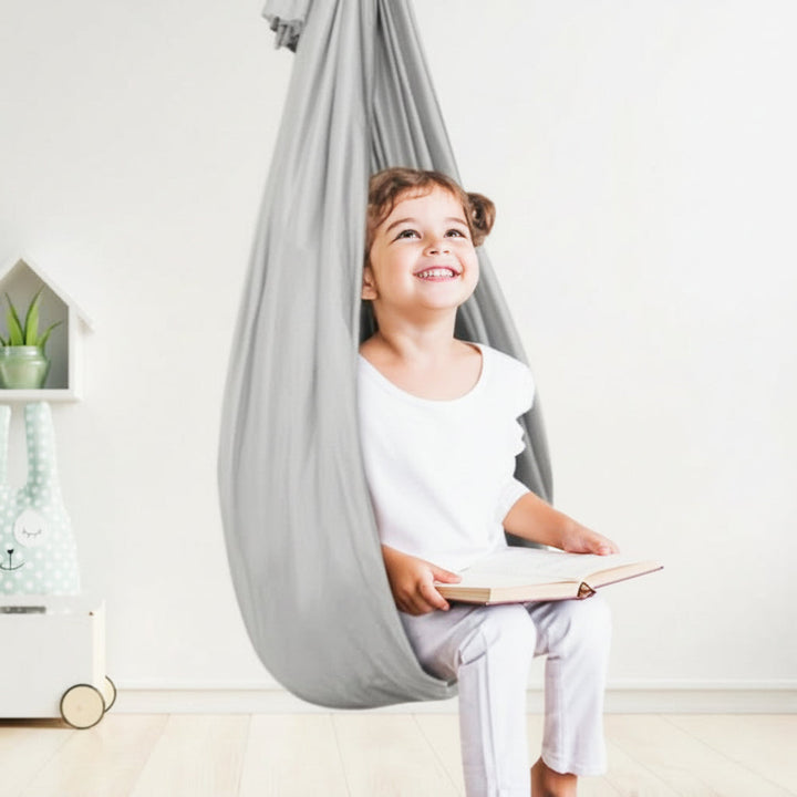 Indoor therapy swing, a versatile children's accessory aiding sensory regulation, calm, & improved focus.