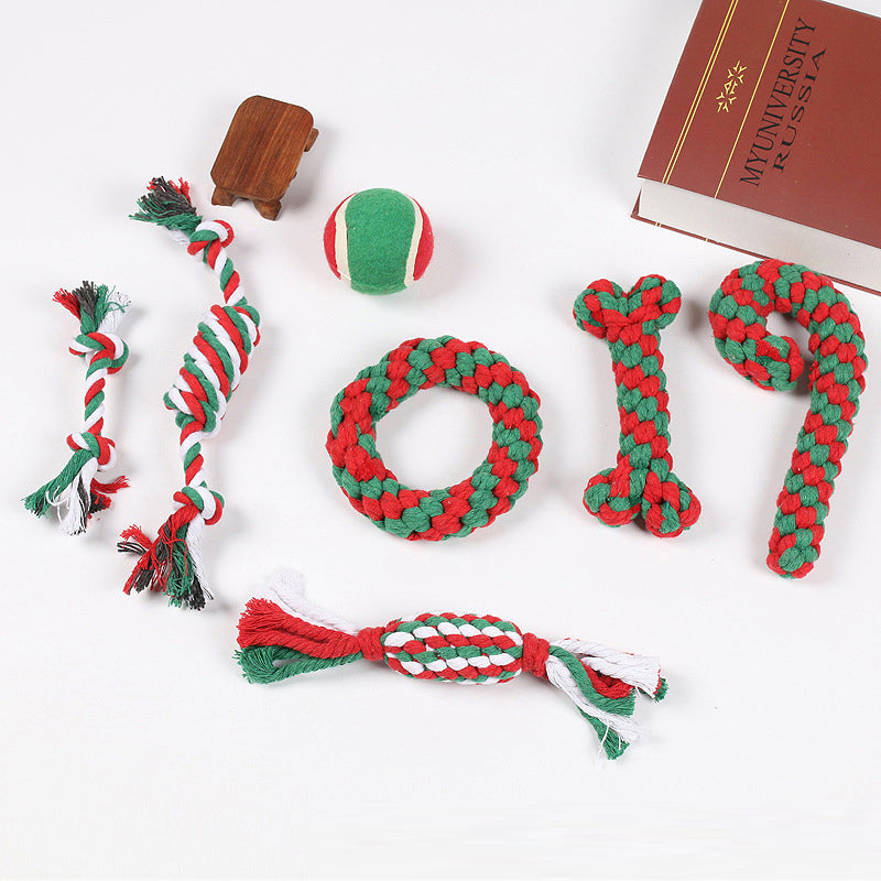 Holiday-themed dog chew toys: red rope, green bone, Santa, and snowman, for teeth cleaning
