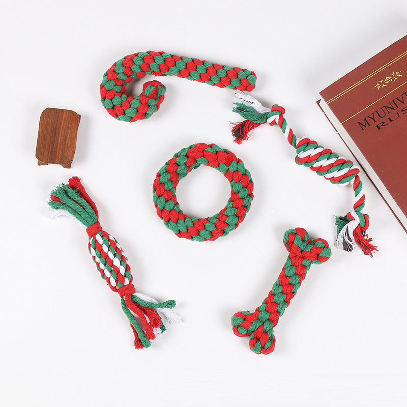 Dog Christmas gift set featuring durable rope chew, squeaky plush Santa, and holiday pet toys