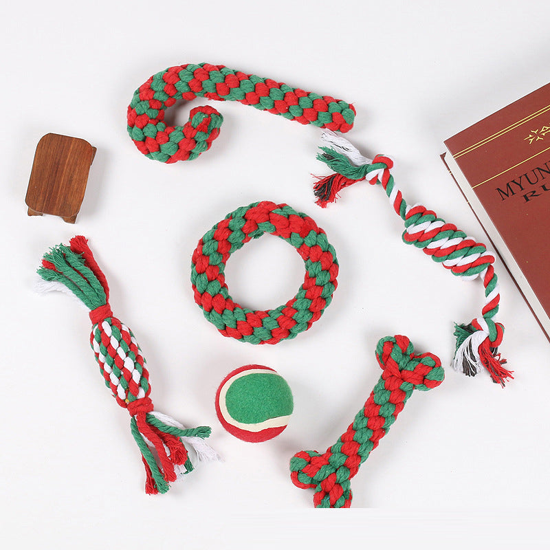 Assorted Christmas dog toys for teeth cleaning and play, includes rope, squeaky and chew toys