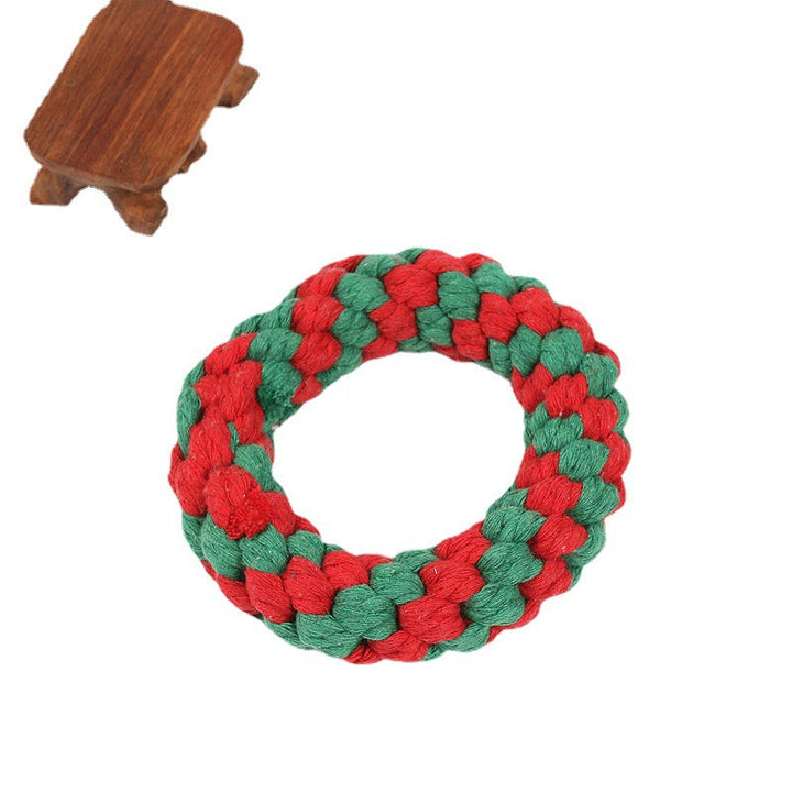 Close-up of Christmas dog toys, showing textured rope for teeth cleaning and soft squeaky animal