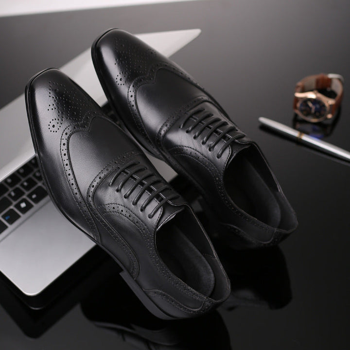 Detailed close-up of men's genuine leather Oxford brogue dress shoes with intricate perforations.