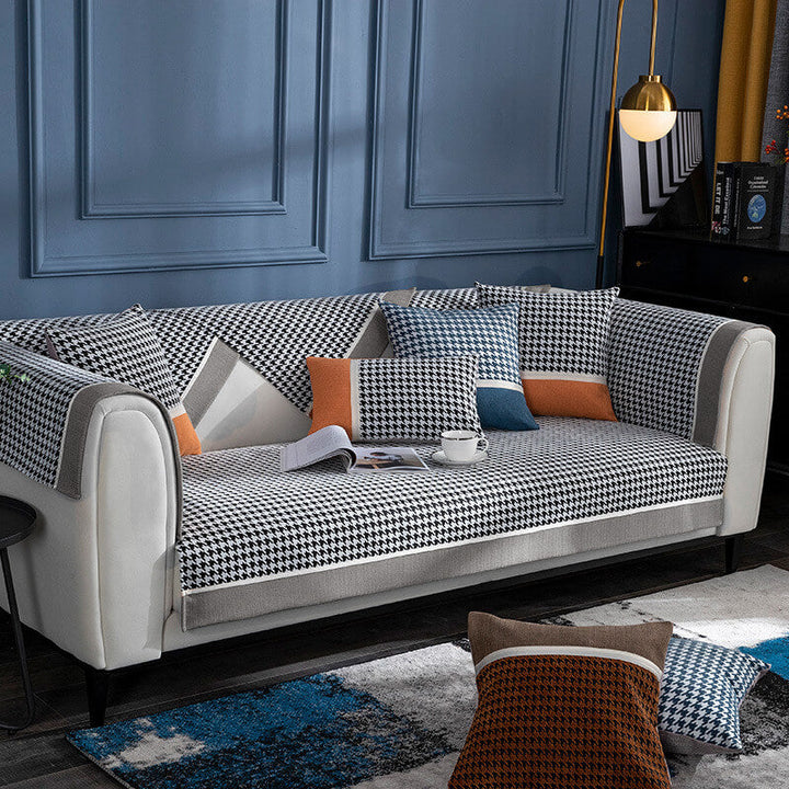 Transform your living room: non-slip houndstooth chenille sofa cover, pet friendly and durable.