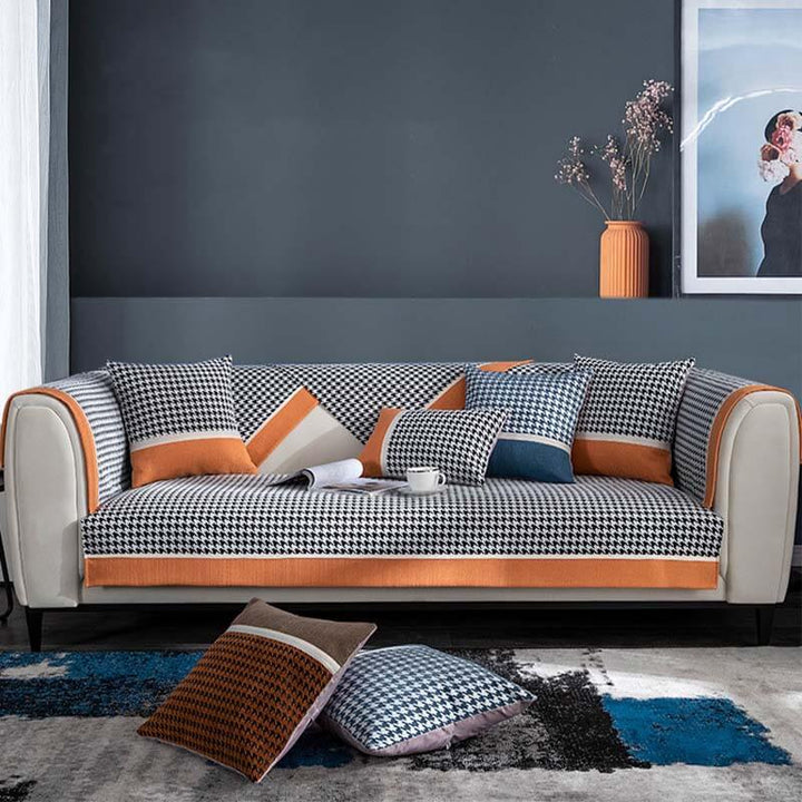 Pet friendly houndstooth chenille sofa cover, non-slip, enhances living room with modern furniture decor.