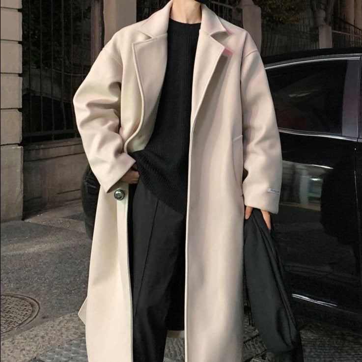 Sophisticated men's long belted overcoat, a versatile piece of winter fashion outerwear for formal occasions.