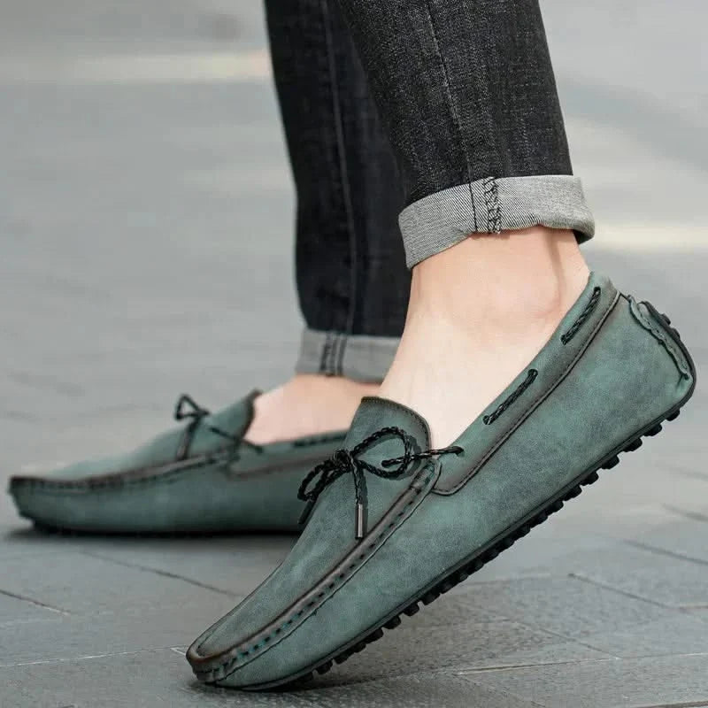 Elegant men's leather slip-on loafers. Classic dress shoes, perfect for everyday comfort and formal occasions.