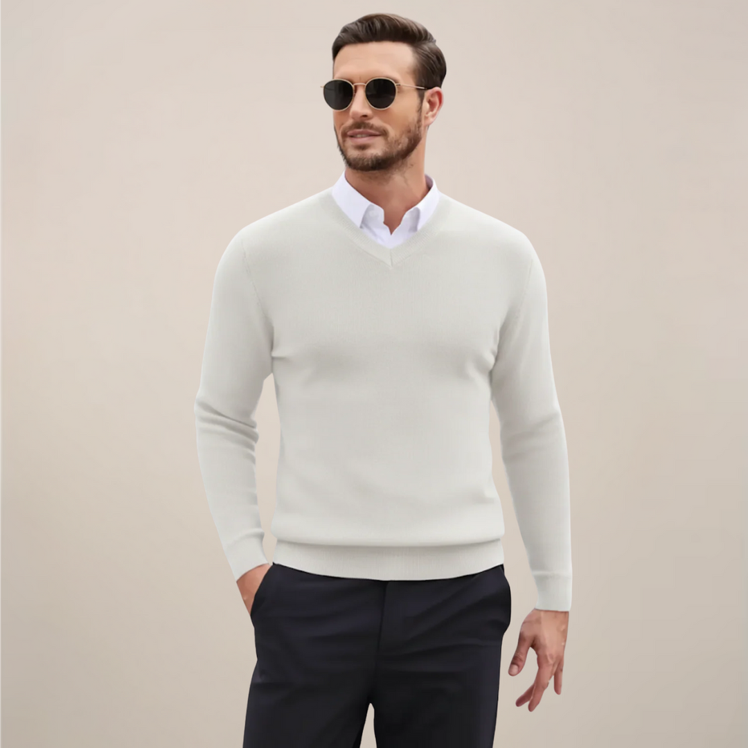 Man wearing a classic V-neck sweater, perfect for layering during fall & winter, offering versatile style.
