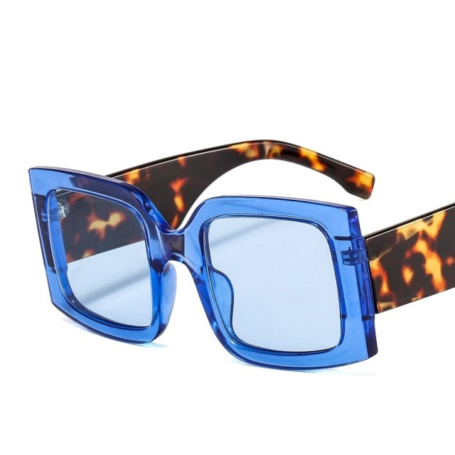 Chic square unisex sunglasses with gradient lenses and durable polycarbonate frame. Features UV protection.