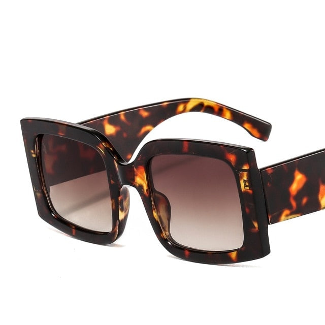 Classic square unisex sunglasses with UV protection, gradient lenses, and a stylish polycarbonate frame.