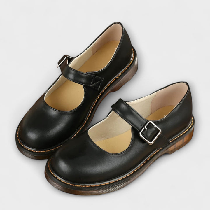 Vintage-style women's Mary Jane flats, brown, with a round toe and elegant buckle. Versatile comfort shoe.