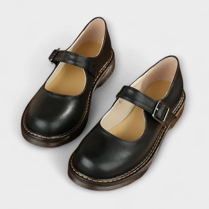 Women's versatile black Mary Jane flats. Classic design, comfortable for casual or formal occasions. Round toe.