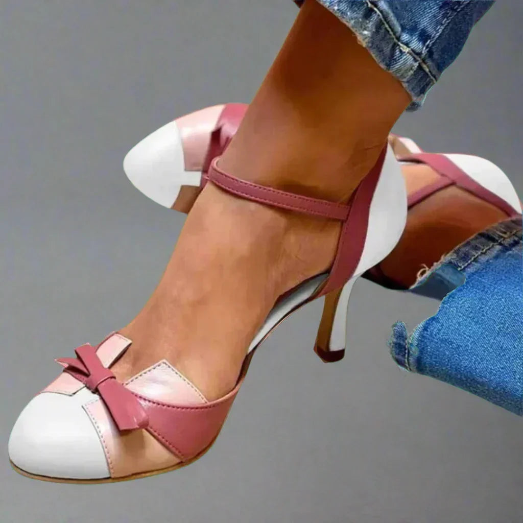 Formal pink women's dress shoes: classic mid-heel pumps with a stylish bow, great for elegant parties.