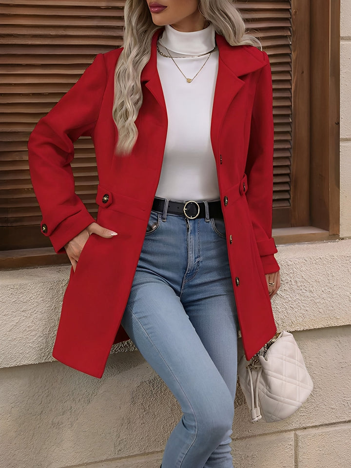 Classic women's fall trench coat, elegant double-breasted design, belted and longline style.