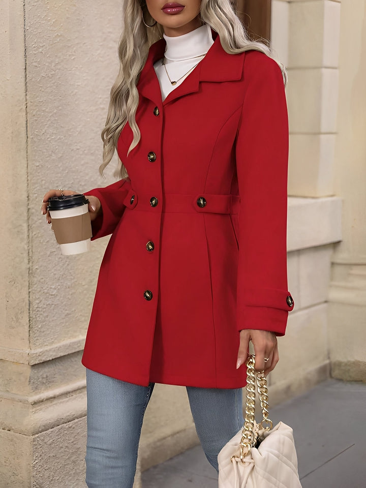 Women's classic outerwear: an elegant trench coat with a notch collar and belted silhouette.