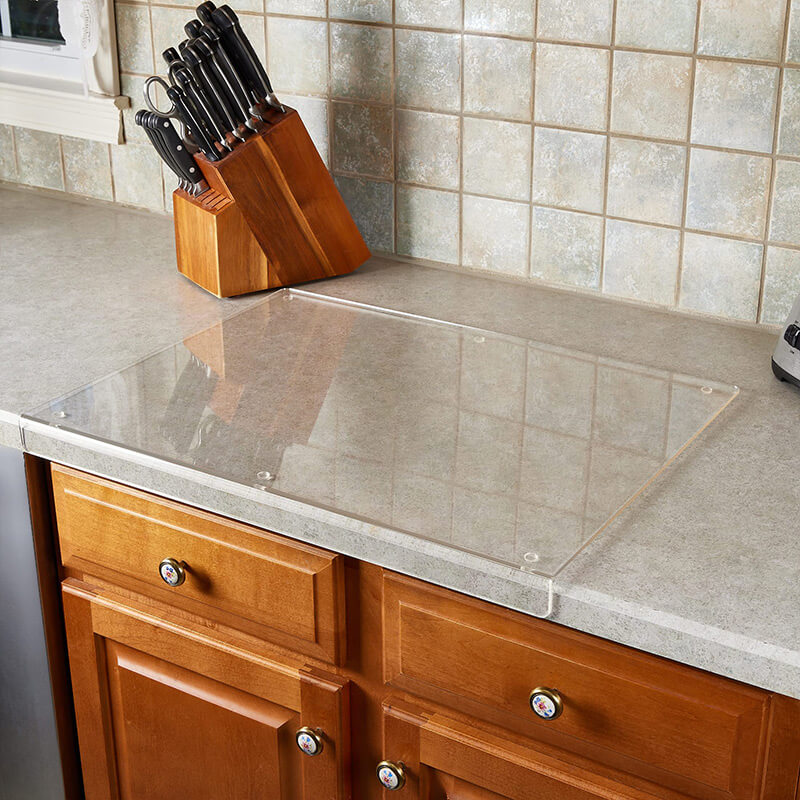 Transparent acrylic non-slip cutting board with stable feet, perfect for kitchen food prep, chopping, and serving.