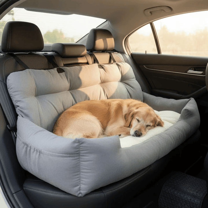 Unisex pet car seat dog bed in car, showing secure non-slip bottom and soft bolster for travel comfort.
