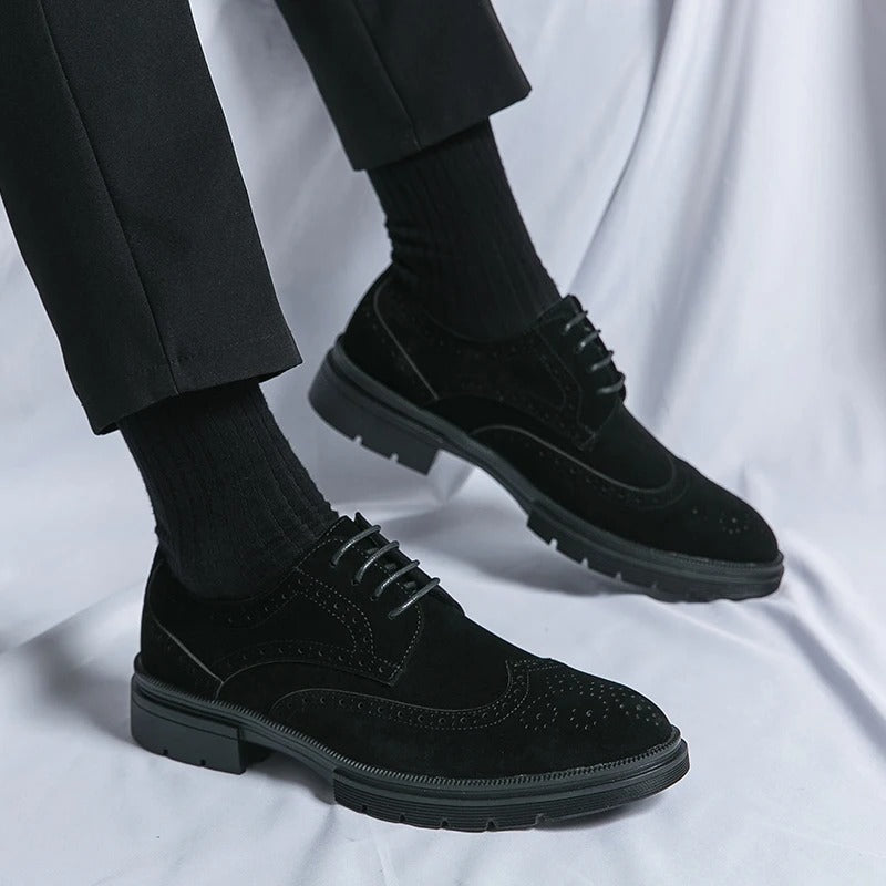 Classic black suede brogue dress shoes, enhancing any formal or casual smart ensemble.