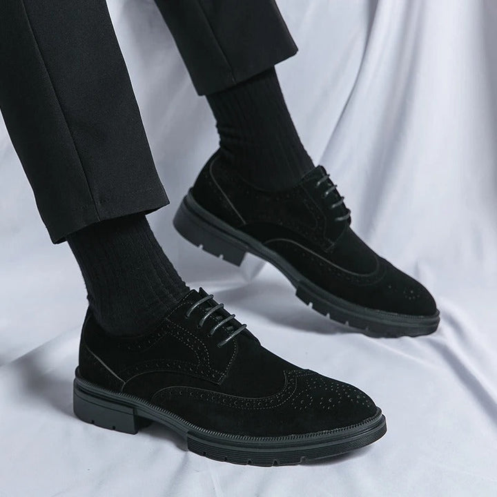 Classic black suede brogue dress shoes, enhancing any formal or casual smart ensemble.