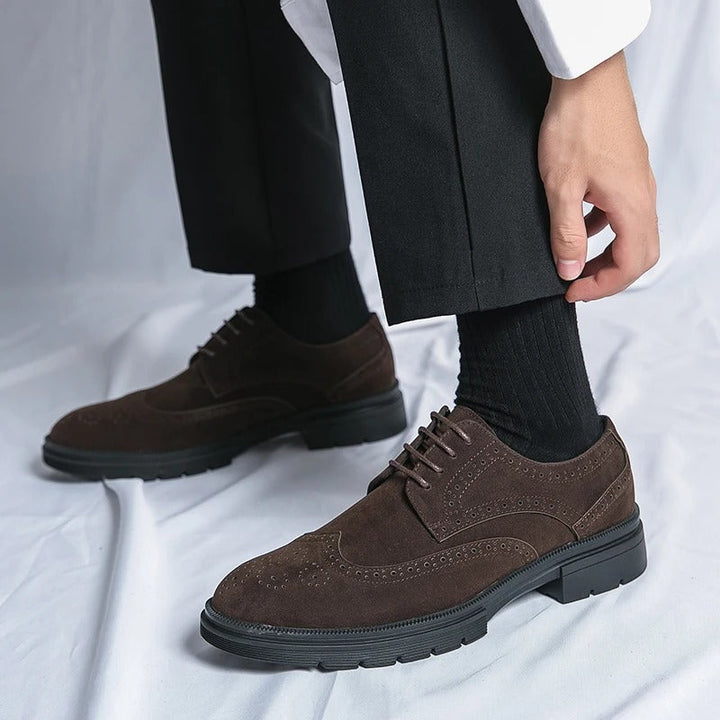 Full view of elegant black suede brogue footwear, ideal for business or formal events.